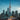 Toronto skyline with CN tower at dusk, reflecting on water