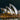 Sydney Opera House at night with illuminated sails.