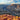 Scenic view of the Grand Canyon with a river cutting through the layered rock formations 
