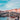 Gondola with tourists on the Grand Canal in front of the Rialto Bridge in Venice.