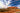 Uluru (Ayers Rock) with a clear blue sky and road in the foreground