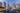 Toronto skyline with boats docked in a marina at dusk.