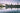 view of Auckland, New Zealand skyline from the harbour at dusk